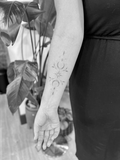 Embrace the delicate allure of the moon with this exquisite dotwork ornamental tattoo by Aleks Fanta.